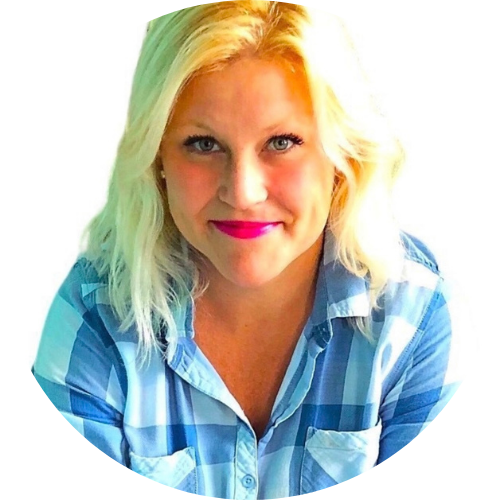 Smiling woman with blonde hair, wearing a blue and white plaid shirt, looking at the camera against a white background—a welcoming member of Our Team.