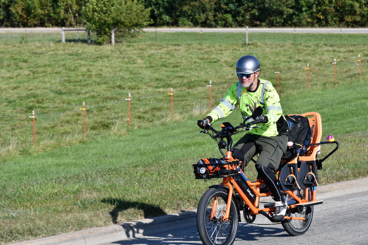 Coach Lawerence riding his orange bike